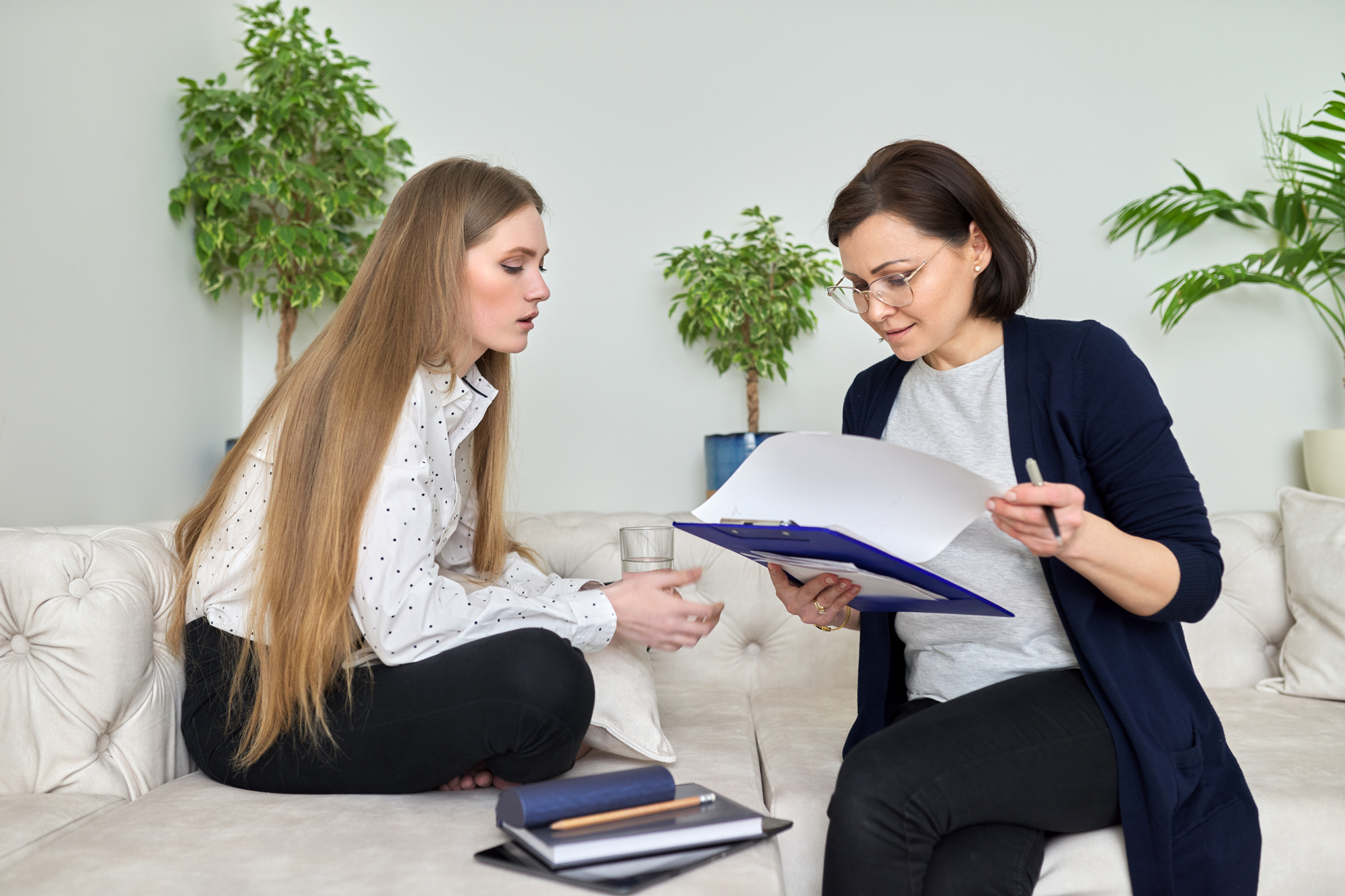 Meeting of young woman patient with psychologist