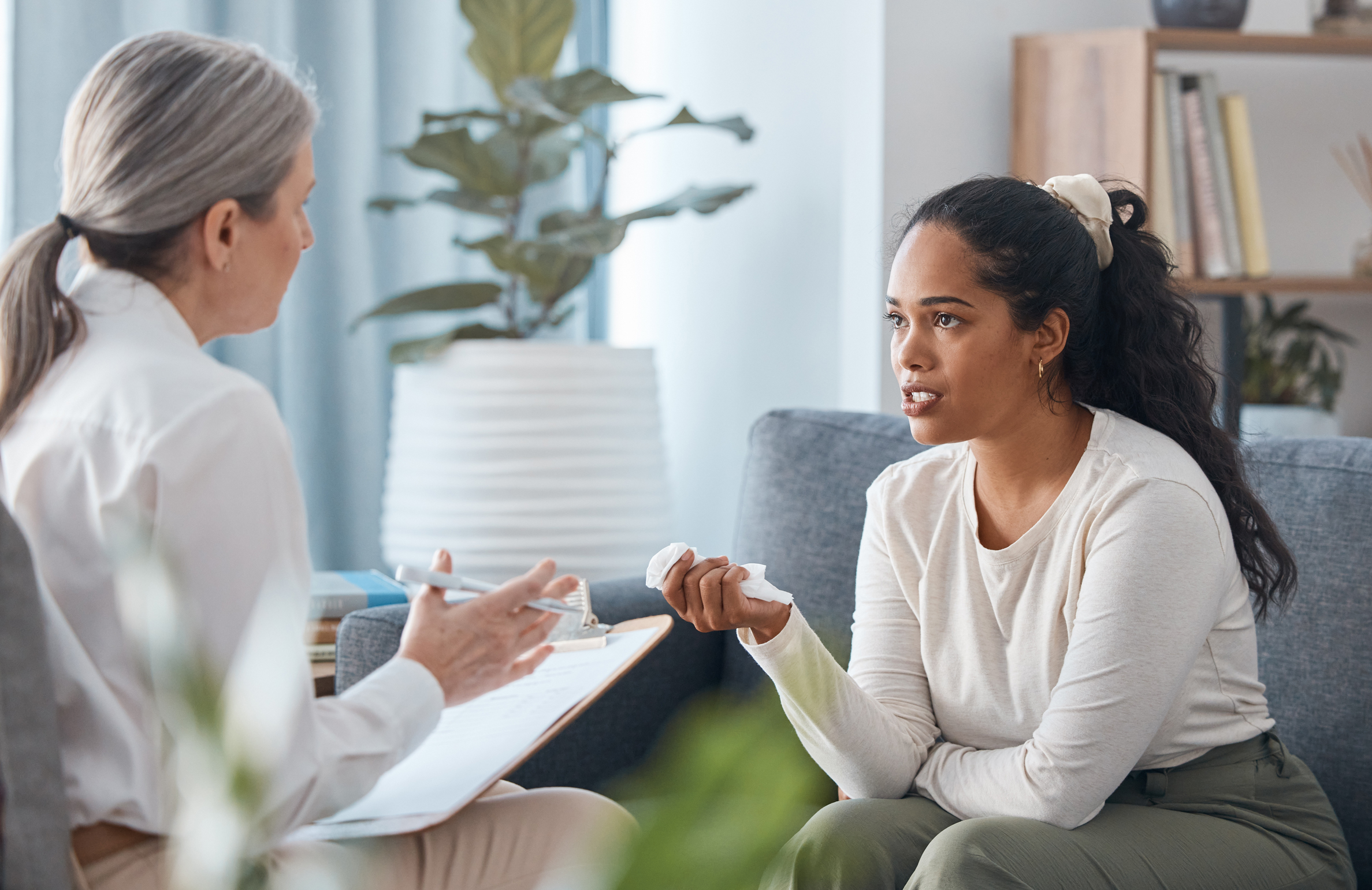 Shot of an attractive young woman sitting and talk